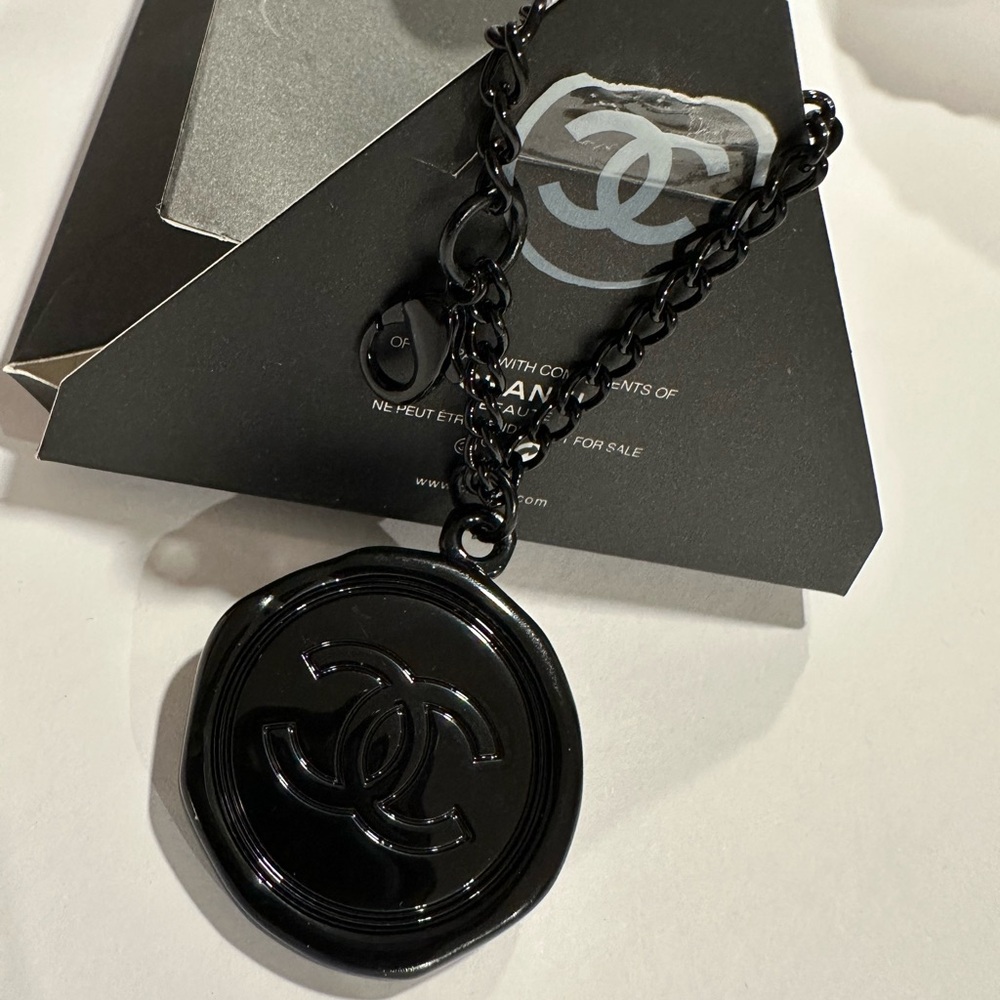 CHANEL Glossy Black Medallion Bag Charm